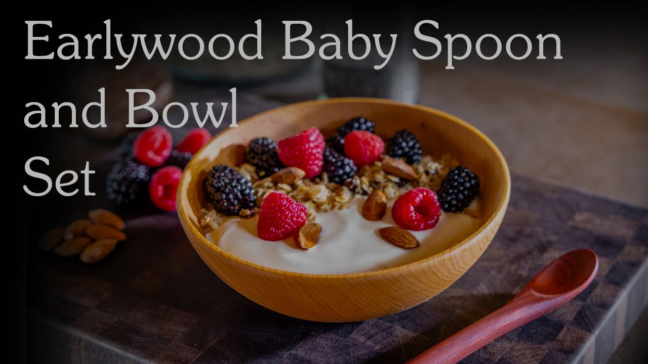 small wooden bowl with wooden baby spoon