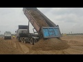 Large trucks dump the ground / ឡានដឹកទំនិញធុនធំចាក់ដី