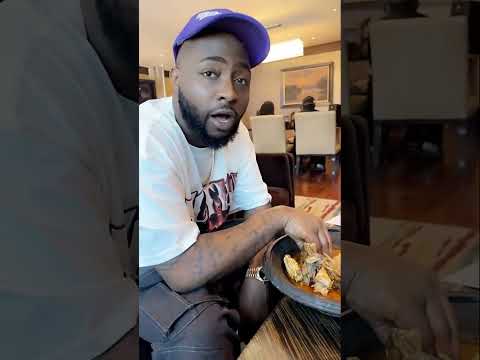 Davido eating Ghana