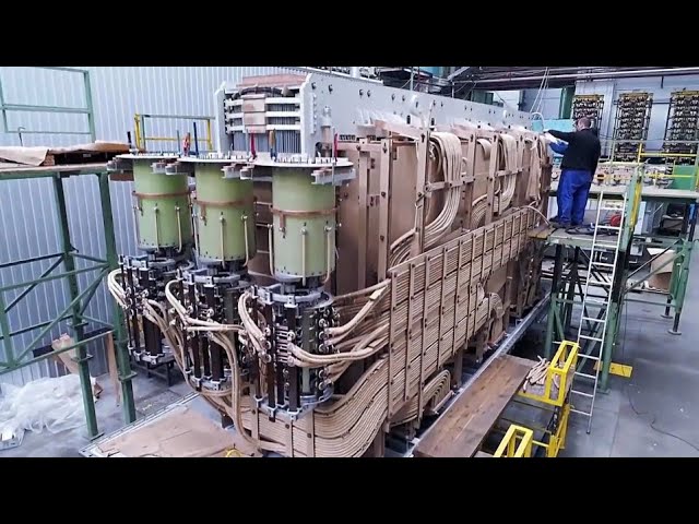 Hypnotic Process Of Manufacturing u0026 Installing Giant Power Transformers. Modern Wire Winding Machine class=