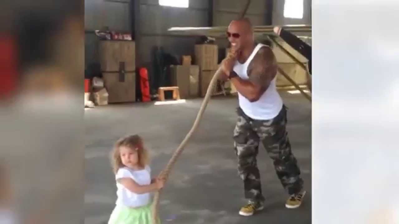 Dwayne 'The Rock' Johnson helps a 2-year-old pull a plane: see the video