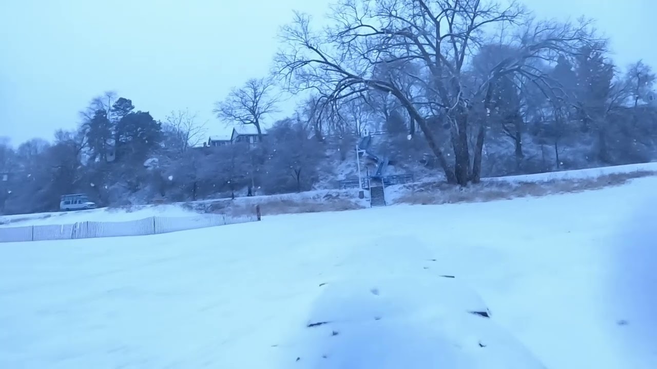 Snowstorm walk on Lake Michigan, North Side Jettys Sheboygan, Wisconsin USA.