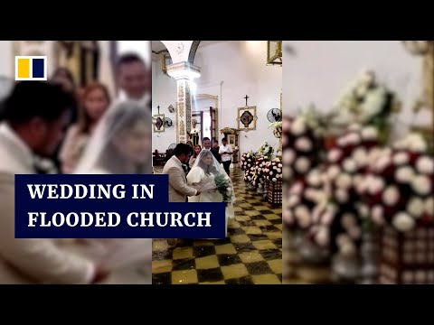 Couple weds in flooded church after Typhoon Doksuri hits Philippines
