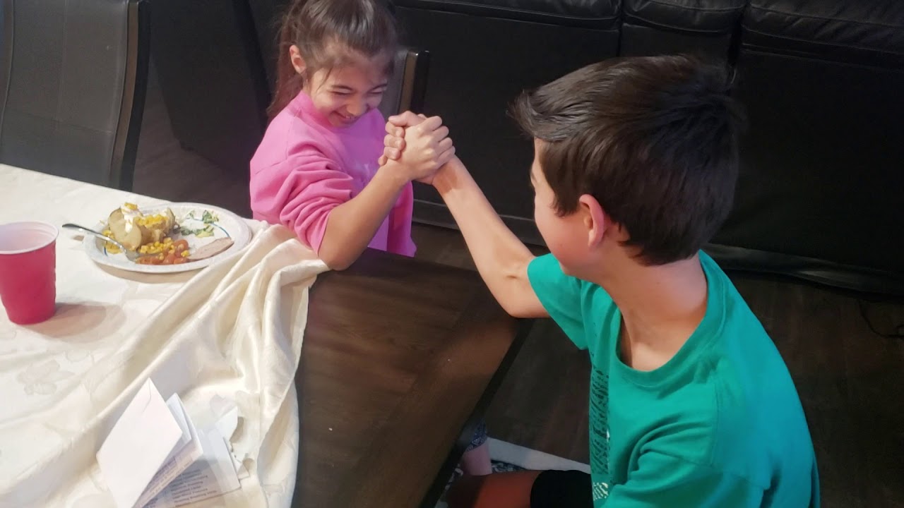 Linda and Dude arm wrestling