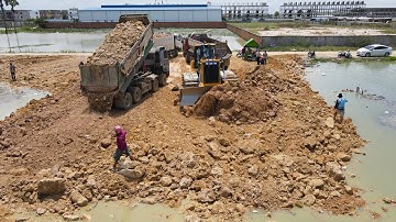 Really Great! New Landfill with Operator Bulldozer, Dump Truck Working Push, Moving Stone into Water