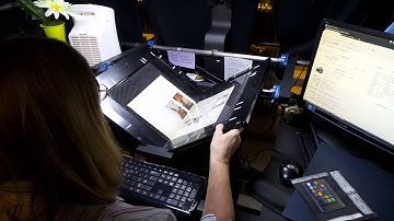 Internet Archive Scanning Center: LaDonna scanning an issue of Softalk magazine