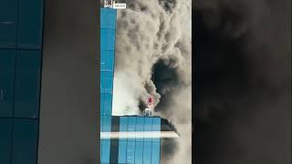 Worker rescued from high-rise fire by crane