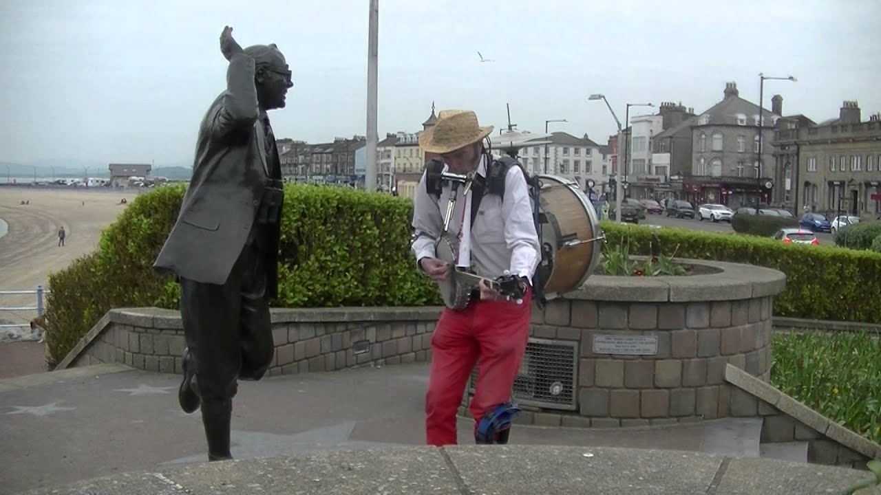One Man Band serenades Eric Morecambe statue