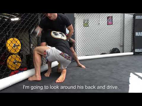 UFC Fighter Alex Volkanovski Teaches an unorthodox Double Leg Takedown variation on the Cage.