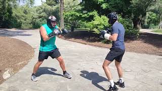 Boxing sparring. Coach vs student. International boxing school in Nice