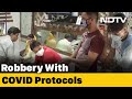 Watch: Men walk into UP jewellery store in masks, sanitise hands, rob it