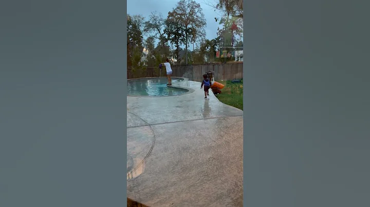 Dad gives son giant lollipop to push mom in the pool #shorts