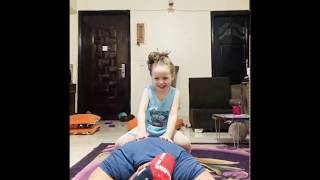 Sweet Little Girl Playing With Her Dad During His Home Workout