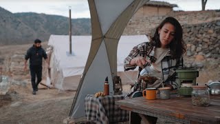 TENT CAMP WITH STOVE IN AN ABANDONED VILLAGE