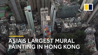 Asia's largest mural unveiled on side of hong kong hotel