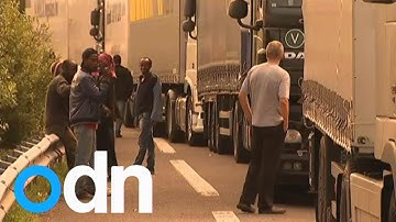 Migrants try to board UK bound trucks amid Calais chaos