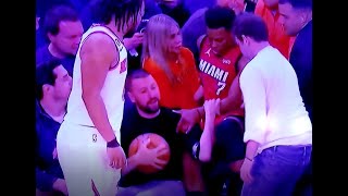 Kyle Lowry dives into girl in crowd in Madison Square Garden and is followed by friendly trash talk