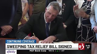 Scott signs measure giving tax breaks to military retirees, seniors and young families