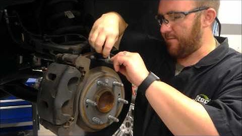 Testing brake rotors using a micrometer and dial indicator