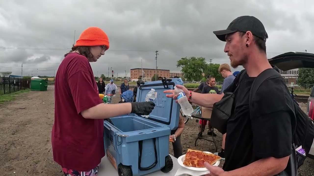 Getting rained on while serving the homeless. Watch til the end to see us Bless our friend Bruce.