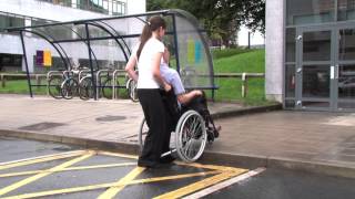 How to use a manual wheelchair - Part 6 Moving up and down kerbs