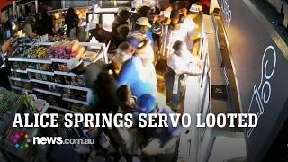 Footage shows crowds rushing Alice Springs service station