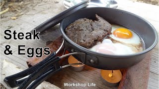 Steak and eggs cooked with 4 Tea lights, Survival cooking made easy.