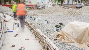 Workers install new tram rails during a reconstruction of the route timelapse.