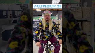 Oliver Tree rides a bike in a store #shorts