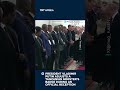 Putin Fixes Tanzanian Minister's Badge In Moscow