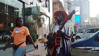 SURVIVORS - SAM KULE $ PASSENGER - In Kampala - Uganda.  #americanboy #streetmusic #subscribe