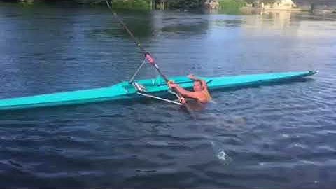 Getting back into a sculling boat from the water
