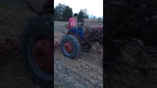 Farmall 140 with chisel plow.