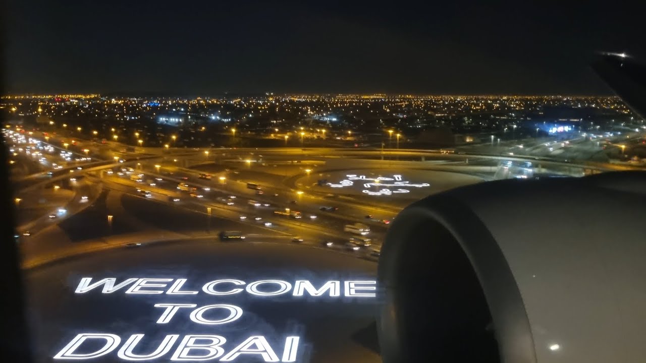 Emirates Boeing 777-300ER landing at Dubai International Airport {DXB/OMDB} RWY30L