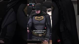‘Batman’ storms city council meeting to protest ICE at Super Bowl