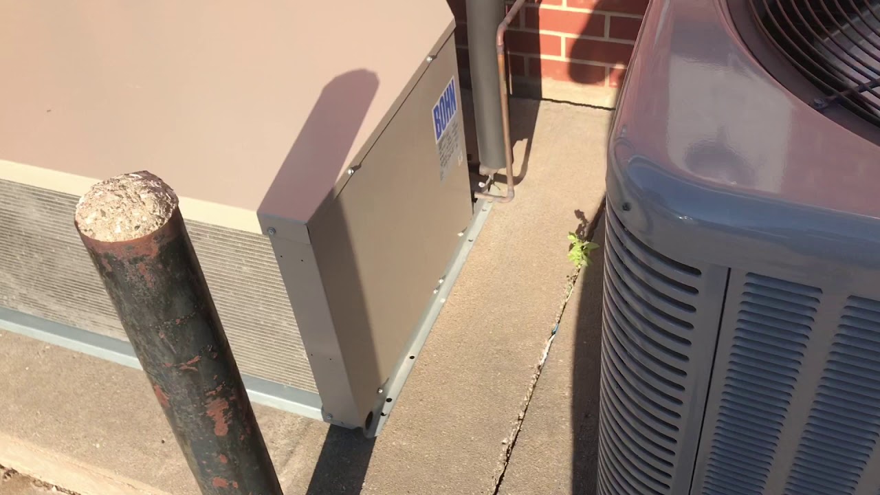 A Rheem central air conditioner and 2 refrigeration components at a gas