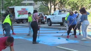Celebrity 'Black Lives Matter' painted in blue on Court Street by crew led by Shawn Dunwoody Wealth
