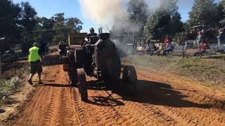 Rumely Oil Pull tractor pulling the sled