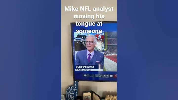 NFL analyst moving his tongue at something