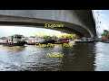 5 tugboats pulling a barge at Chao Phraya river in Thailand