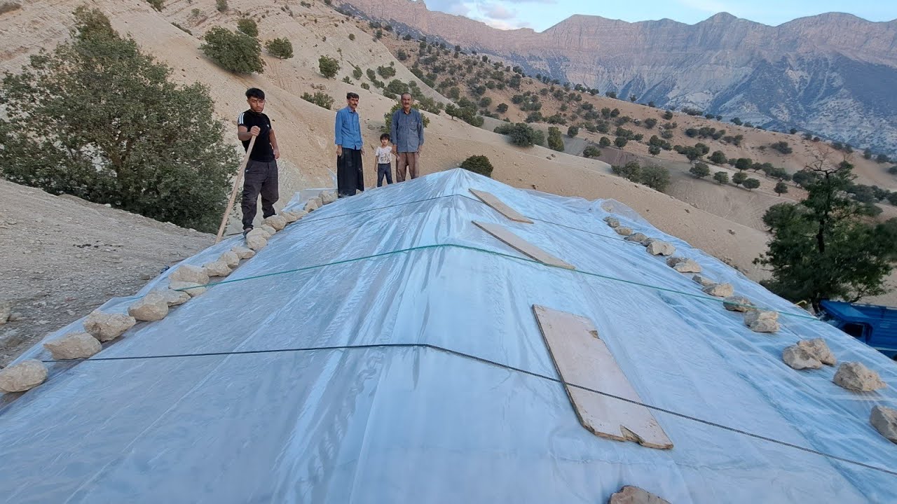 Nomadic documentary: Iranian nomads cover the roof of the house with plastic