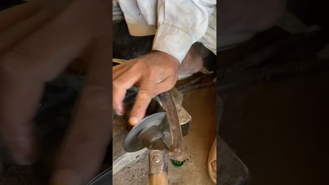 Blacksmith making sickle 