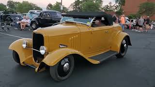 Cars cruising at the Kickoff Party of the 2024 Goodguys Summit Racing Nationals in Columbus, Ohio
