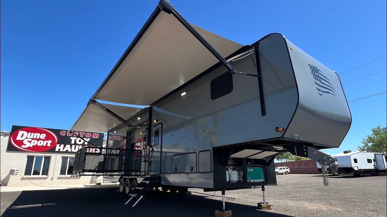Check out this Custom 40’ Dune Sport Fifth Wheel Toy Hauler