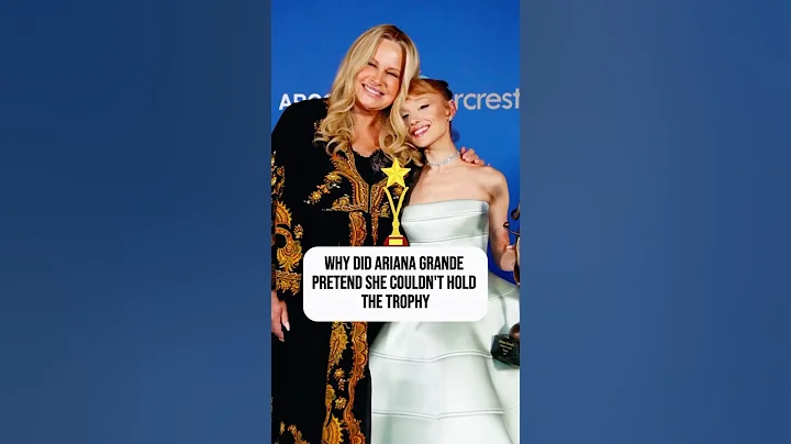 Why did Ariana Grande pretend she couldn't hold her trophy while receiving her award?#celebrities