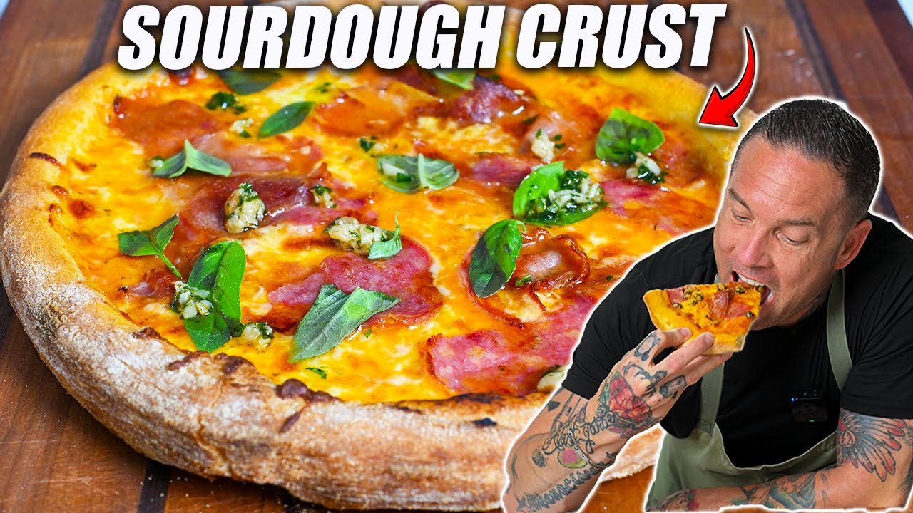 Chef preparing pizza dough with a stand mixer