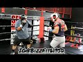 Coach Bizz teaching a student the basics of sparring.