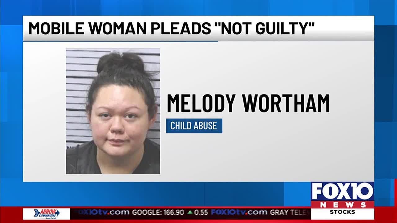 Mobile woman pleads 'not guilty' in charges of child abuse - YouTube