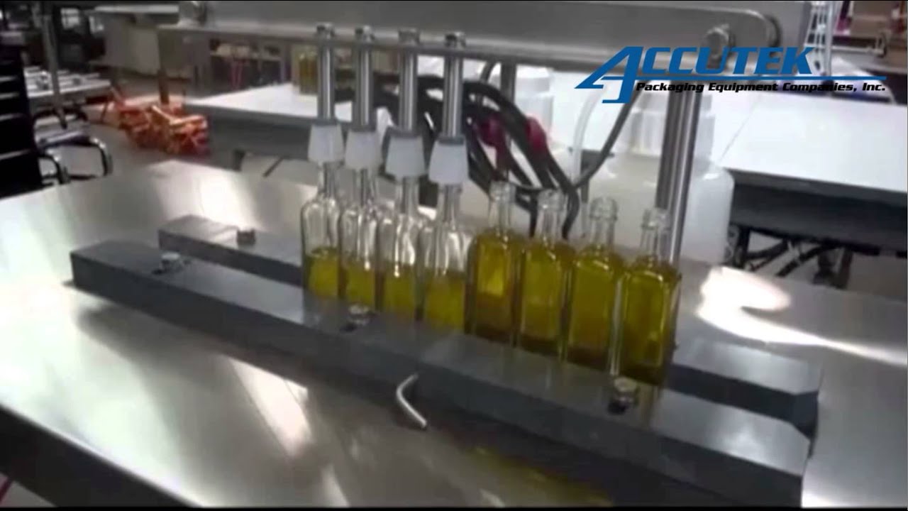 Filling machine SemiAutomatic 4 Head Vacuum Filler Accutek Packaging Equipment Companies