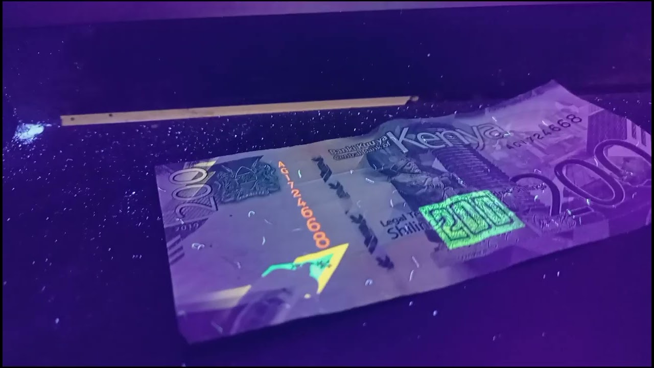 Difference between a fake and original 200 shillings Kenyan Currency.